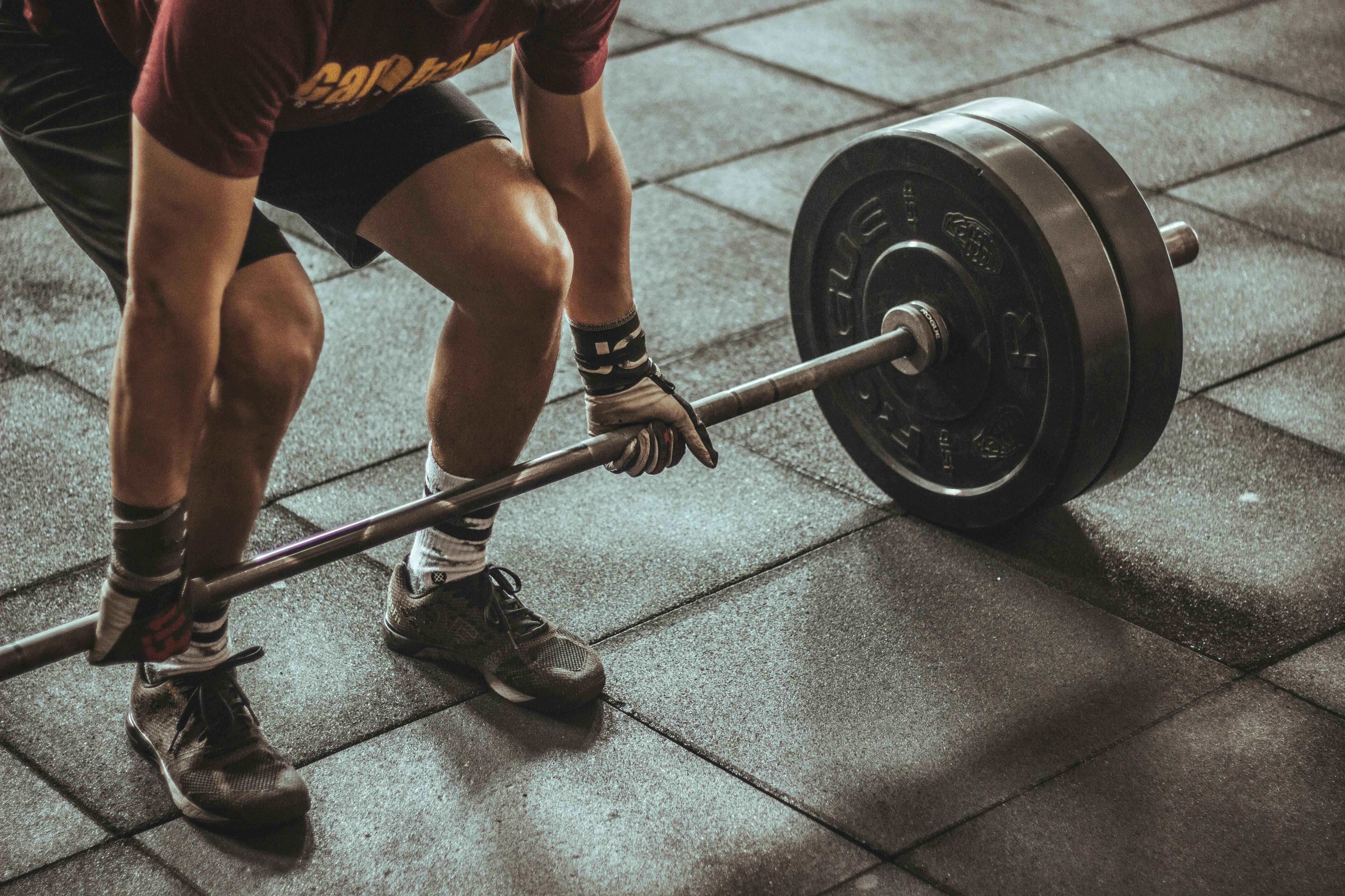 Gym member training with premium equipment